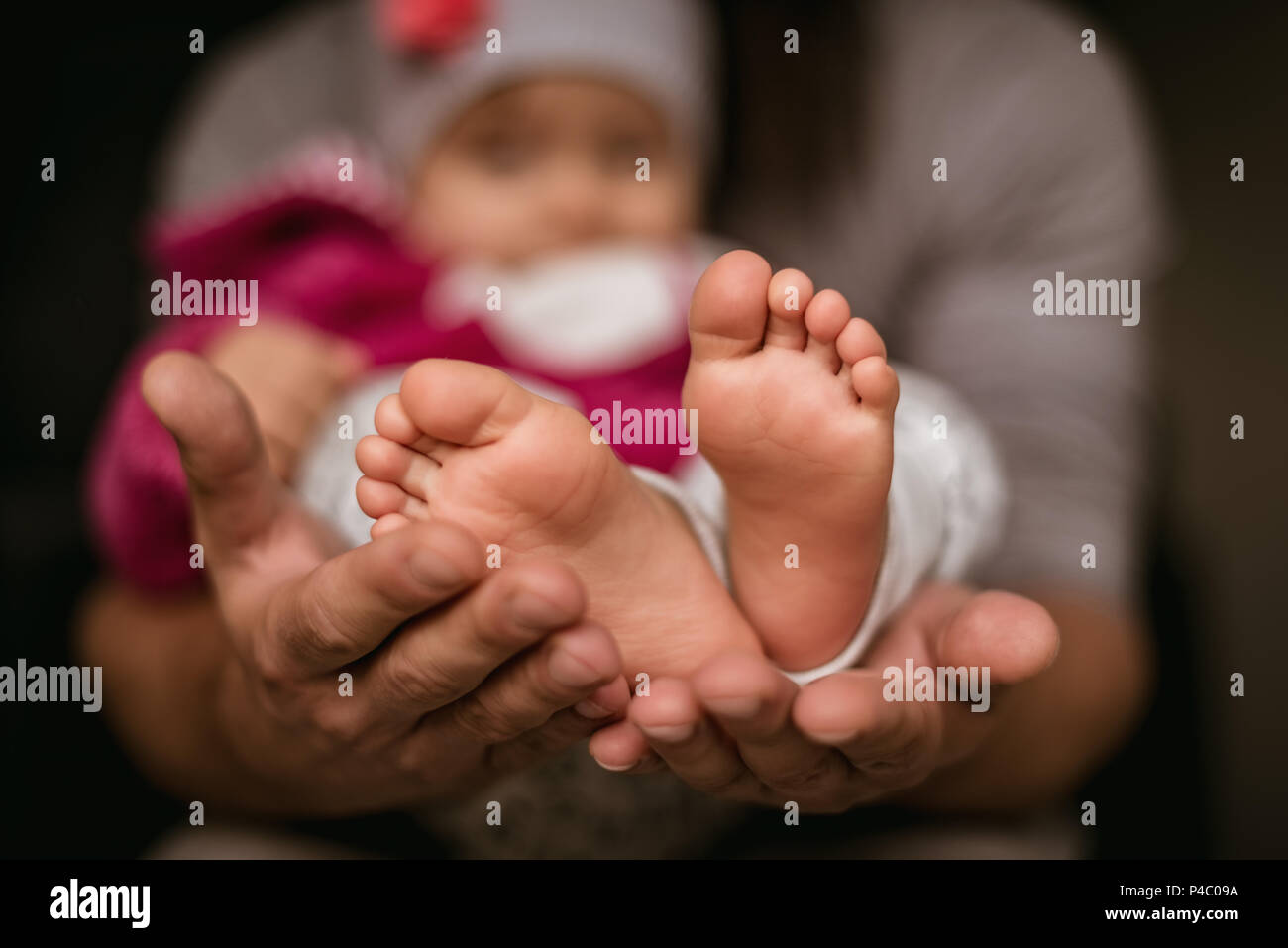 Father holding baby in hand Stock Photo - Alamy