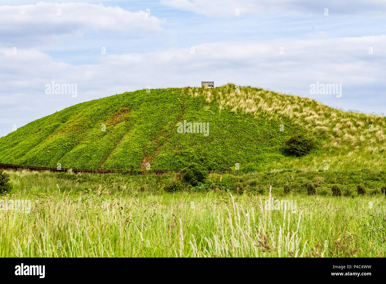 Picnic bench on top of a sand dune at Bamburgh beach. Voted as a Top 10 Picnic Spot in 2013. Bamburgh, Northumberland, UK. June 2018. Stock Photo