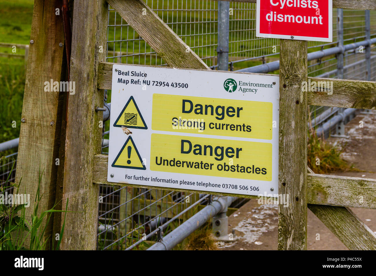Danger sign warning of hazards at Beal Sluice on the north east ...