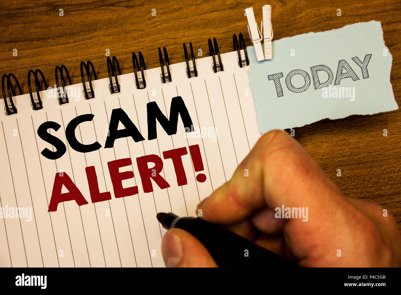 Text sign showing Scam Alert Motivational Call. Conceptual photo Safety warning to avoid fraud or virus attacksMan creating for today on notebook Hand Stock Photo