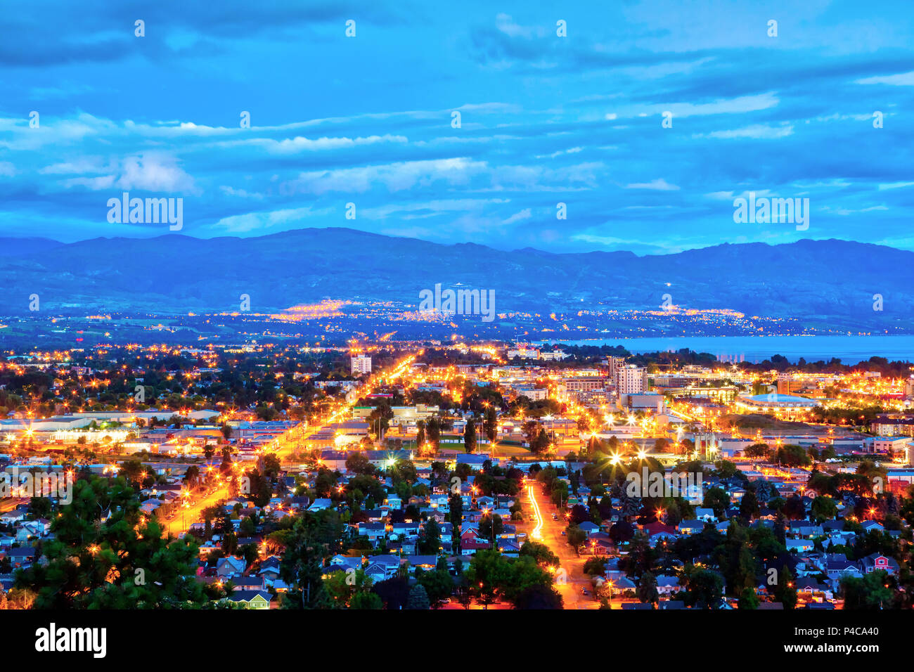 Aerial View of Kelowna, British Columbia, just after sunset on Knox Mountain, Canada, showing downtown and residential districts with bright night lig Stock Photo