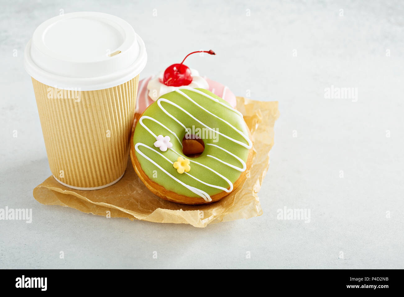 Two glazed donuts with coffee Stock Photo Alamy