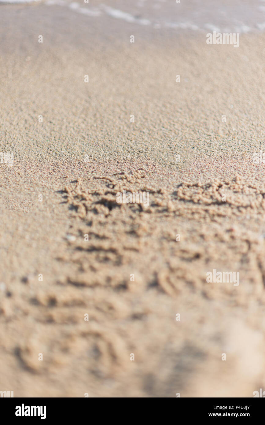 Handwritten message on the sand on a beach near the water Stock Photo ...