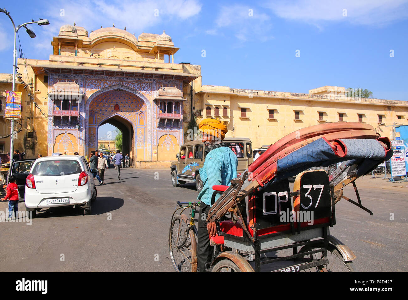 Cycle rickshaw near City Palace in Jaipur, India. Palace was the seat of the Maharaja of Jaipur, the head of the Kachwaha Rajput clan. Stock Photo
