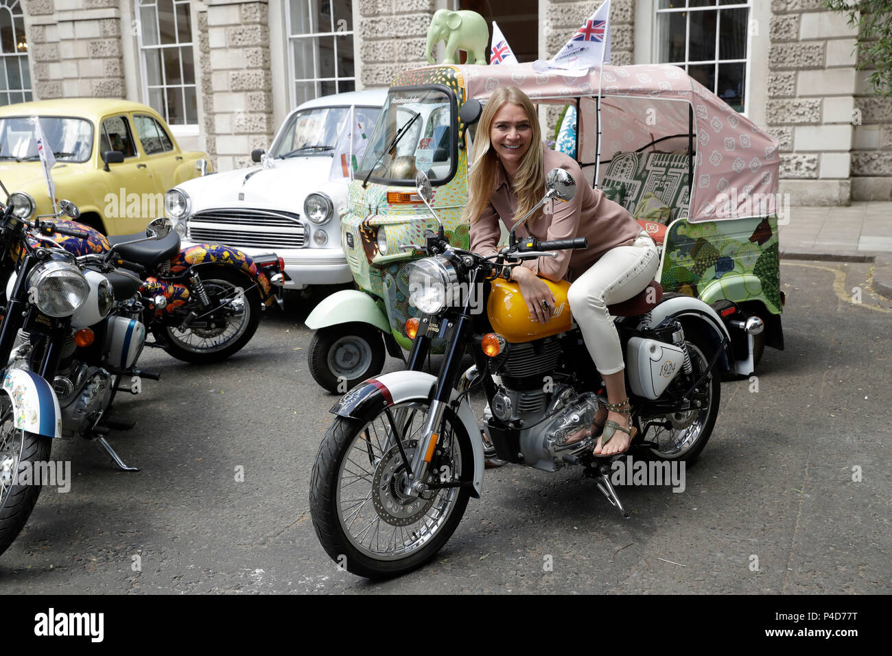 Model and racing driver Jodie Kidd sits on a motorbike prior to the