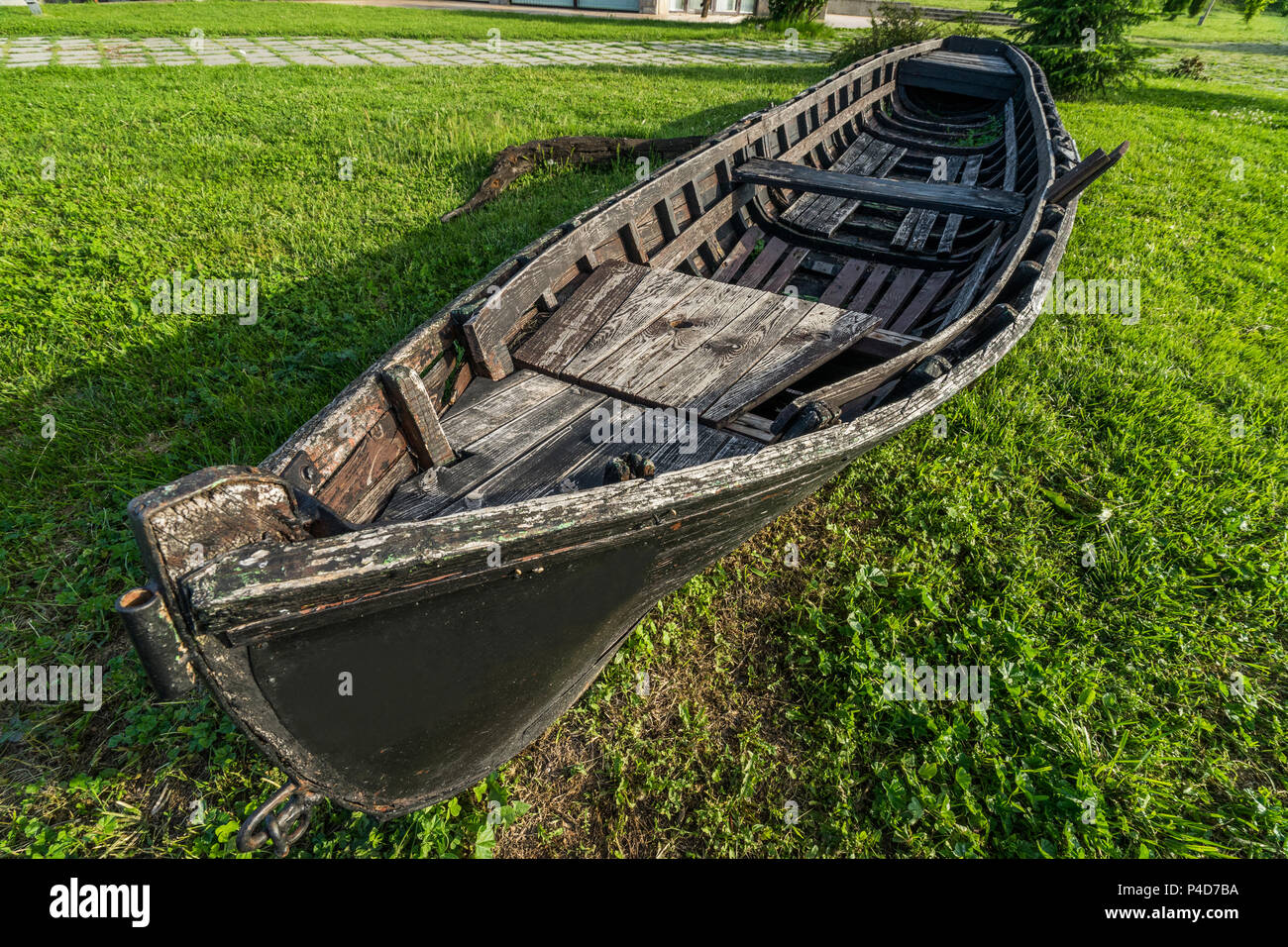 Old wooden boat abandoned on the shore Stock Photo - Alamy