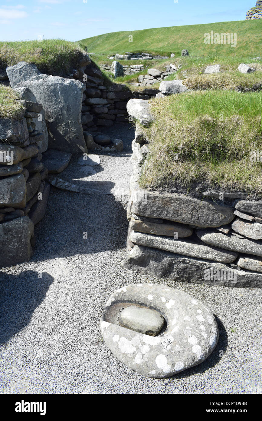 Bronze Age Grinding Stone at Jarlshof, Shetland Islands. Stock Photo