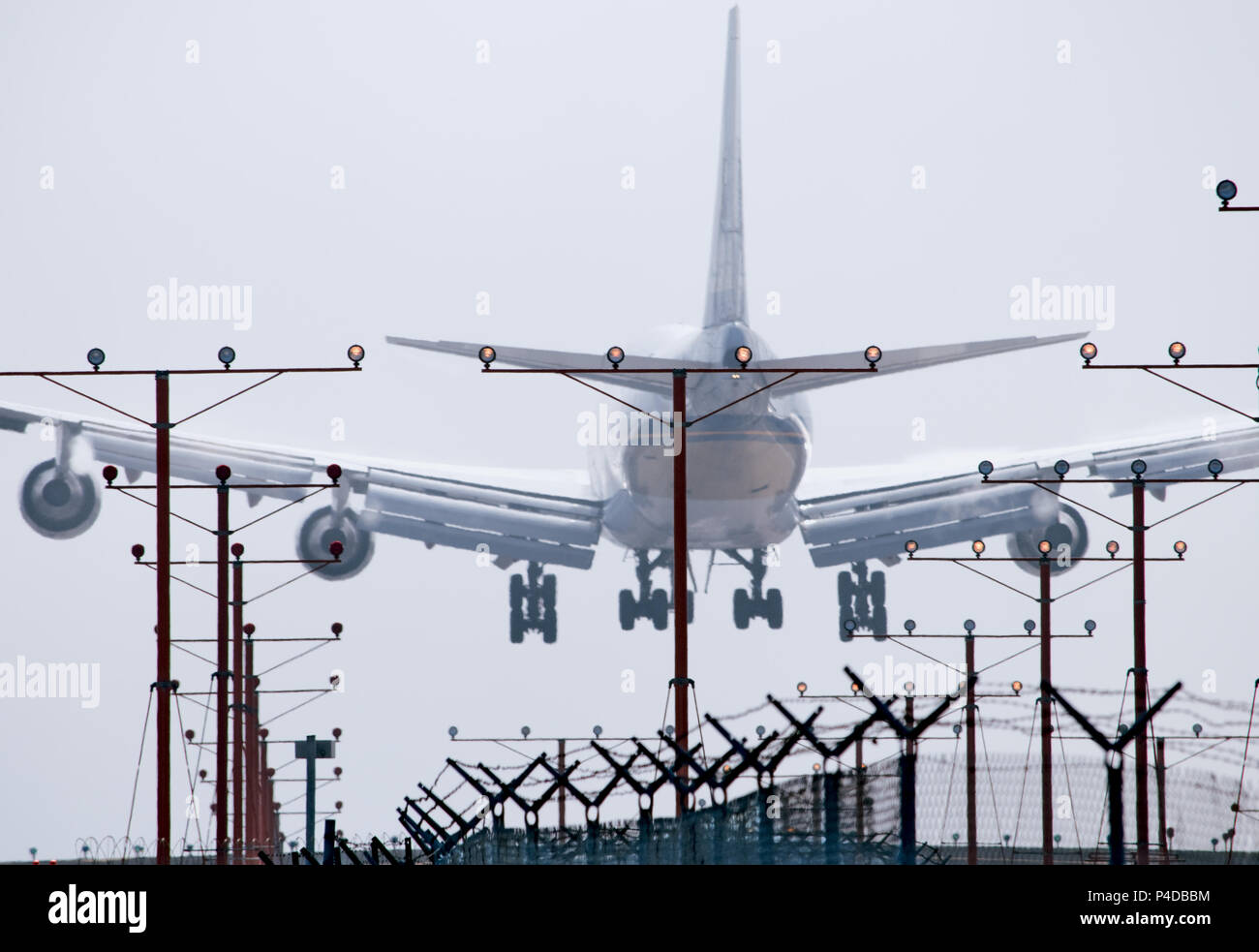 Boeing 747 landing at airport Stock Photo