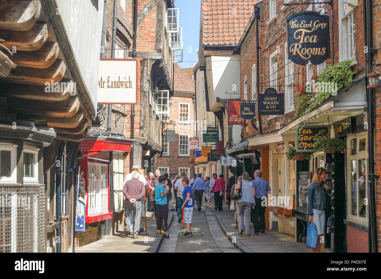 The Shambles, York, UK August 05, 2011 Holiday makers busy doing