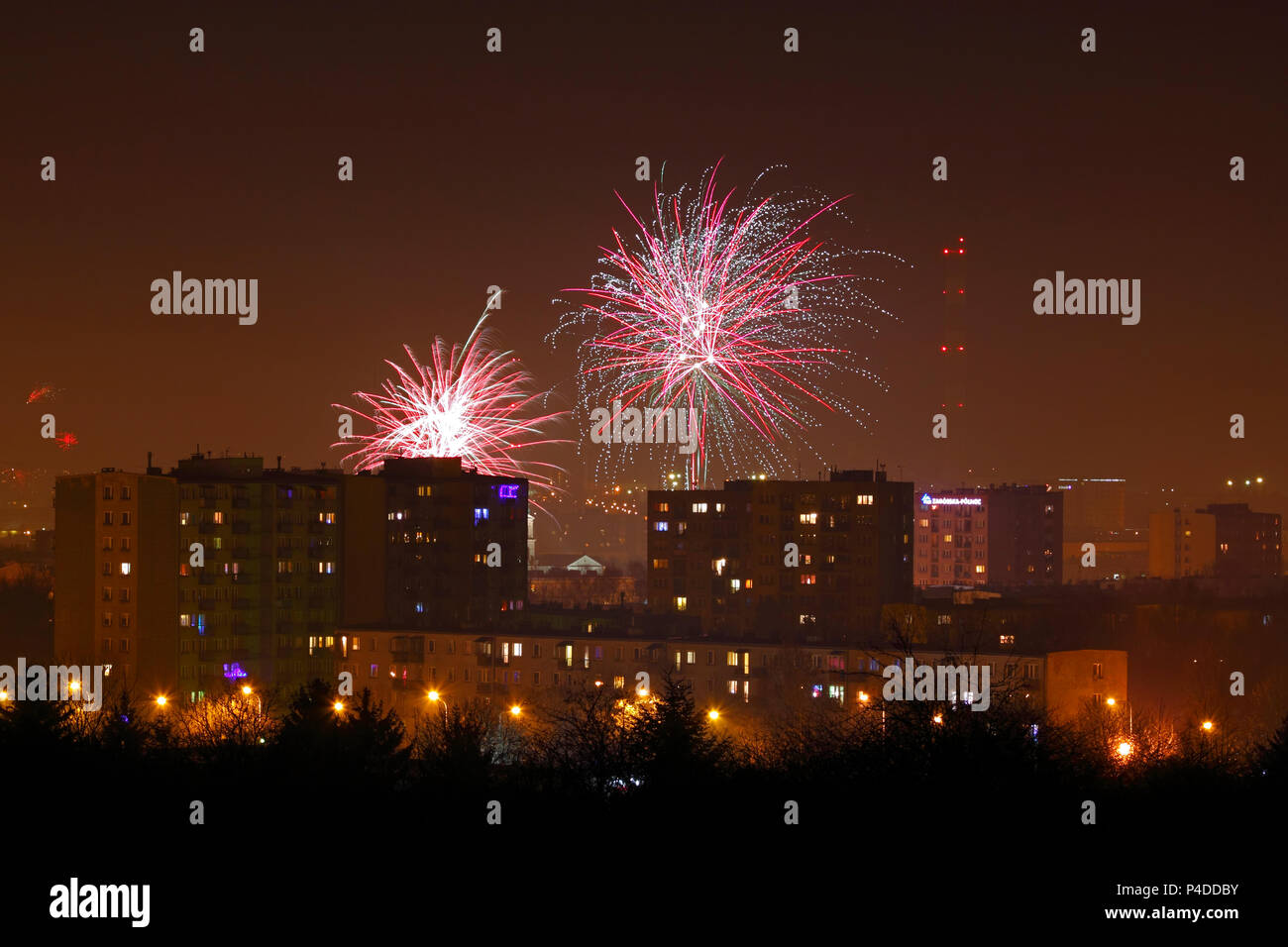 Night shot of a fireworks over city. Poland, Kielce, The Holy Cross Mountains. Stock Photo