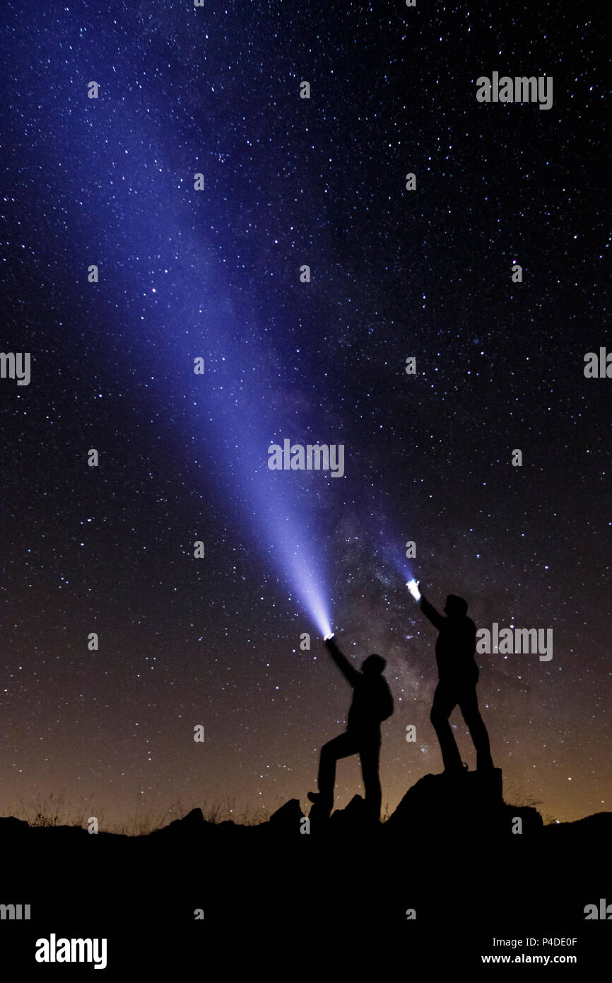 Night photography of the Milky way with human figure at Camprodon valley, Girona, Catalonia. Stock Photo