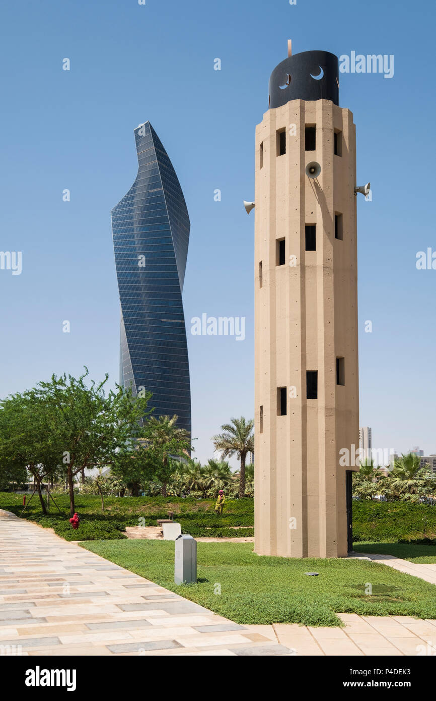 Skyscraper and Mosque Minaret at  Al Shaheed Park in Kuwait City, Kuwait Stock Photo