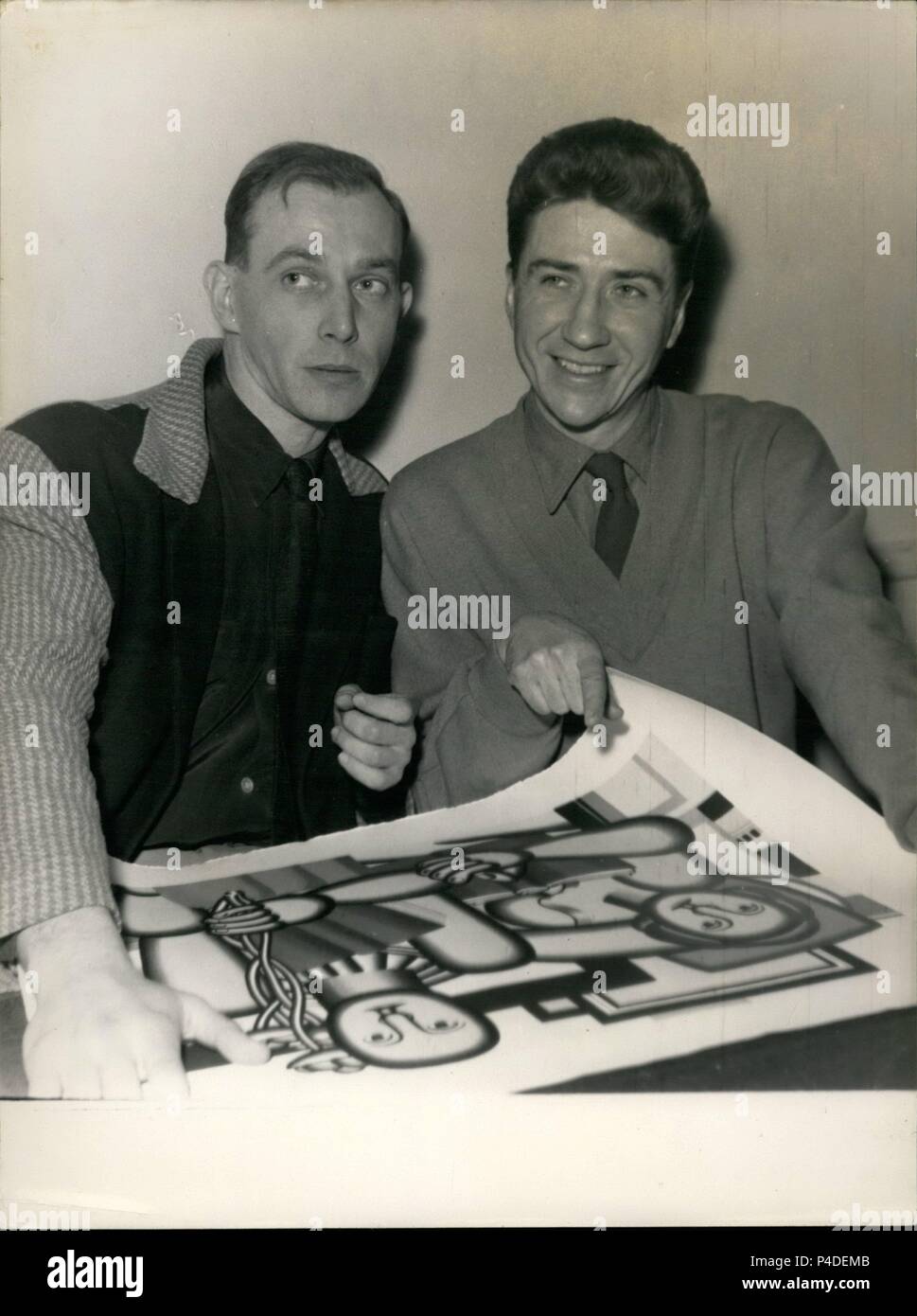 Description: Feb. 02, 1954 - Film Producers Rewarded. Alain Resnais, left, examine a painting they received as a reward for the film ''Les Statues Meurent Aussi'' (Statues Die Also). This is the Prix Jean Vigo Awarded to producers of a film ''showing a great independence of mind'' and a high quality of realisation. (Credit Image: © Keystone Pictures USA/ZUMAPRESS.com).  Stars: ALAIN RESNAIS; JEAN VIGO. Stock Photo
