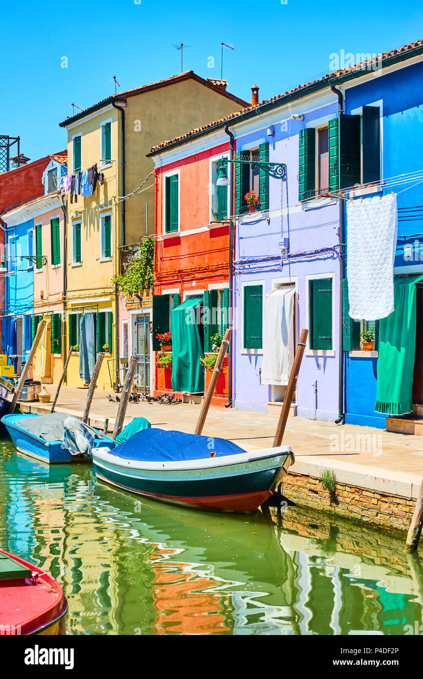 Colorful small houses by canal in Burano, Venice, Italy Stock Photo - Alamy