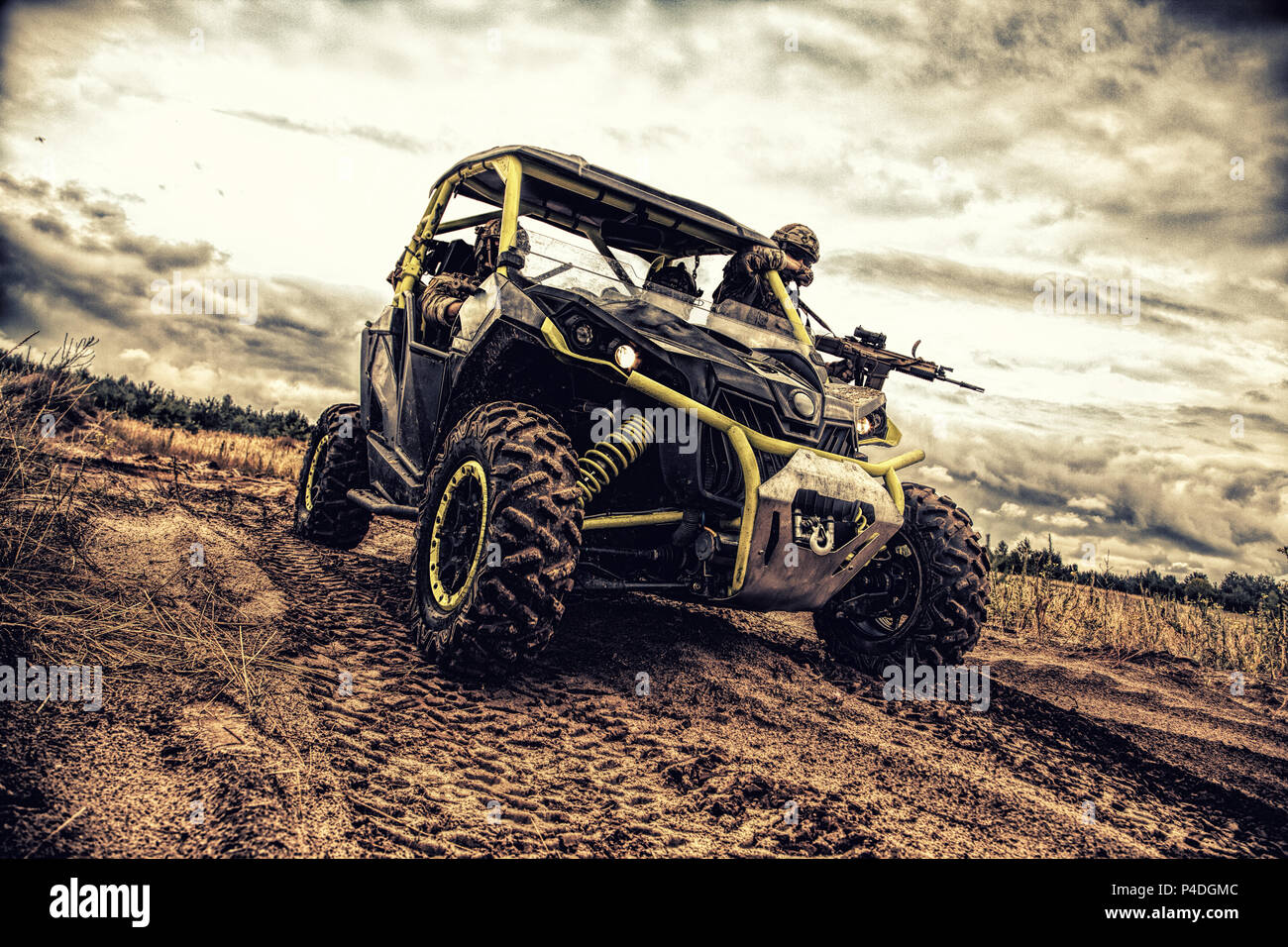 Mobile infantry team goes on military buggy Stock Photo