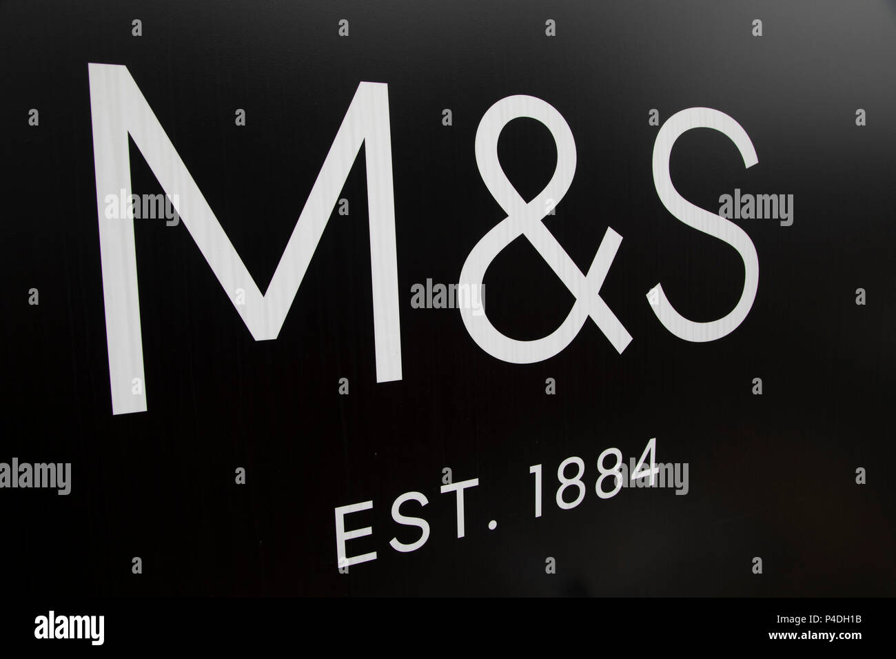 Sign for department store and supermarket chain Marks and Spencer in Birmingham, United Kingdom. Marks & Spencer Group plc, also known as M&S, is a major British multinational retailer and specialises in the selling of clothing, home products and luxury food products. Stock Photo