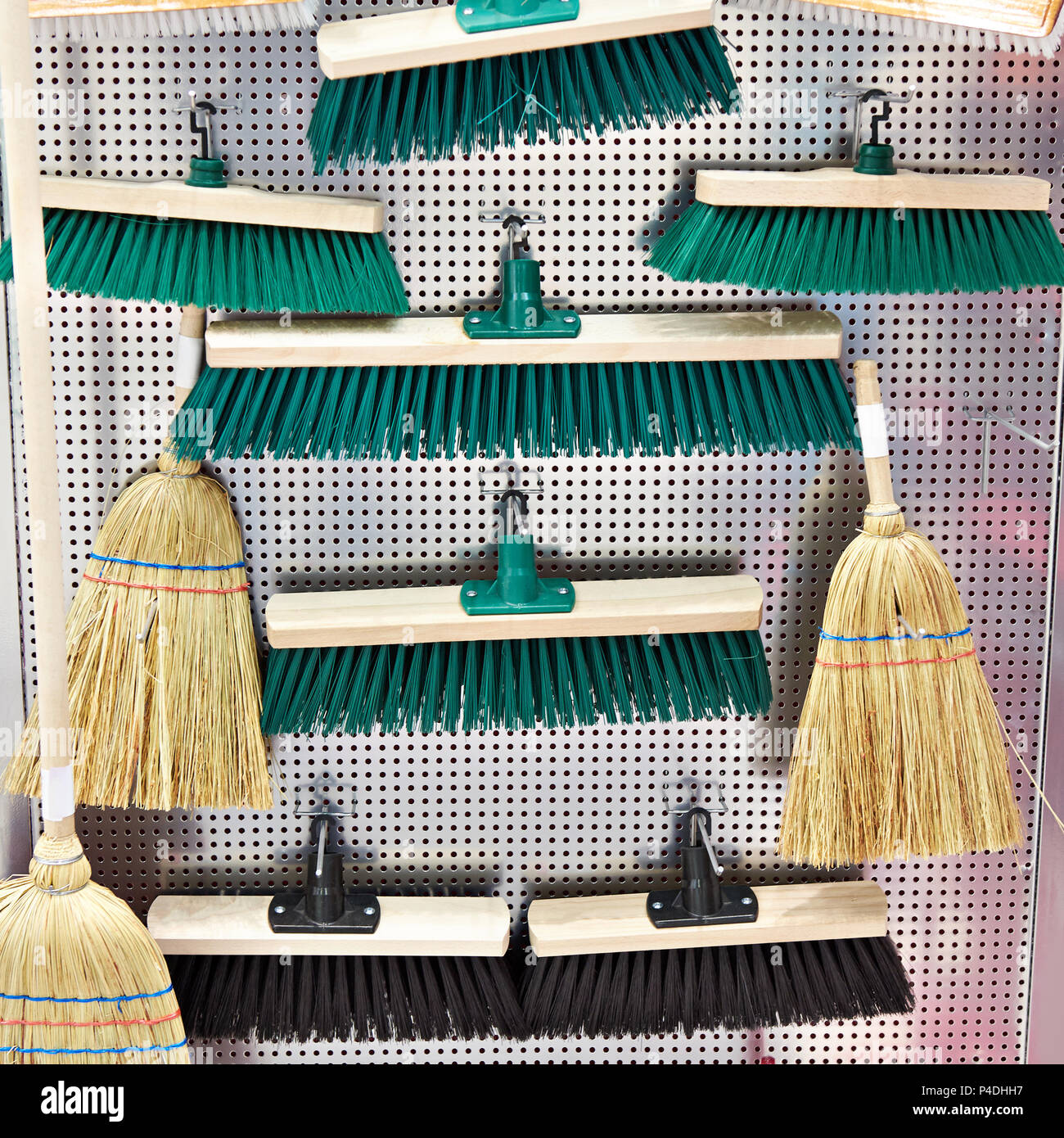 Wooden household brushes in the hardware store Stock Photo Alamy