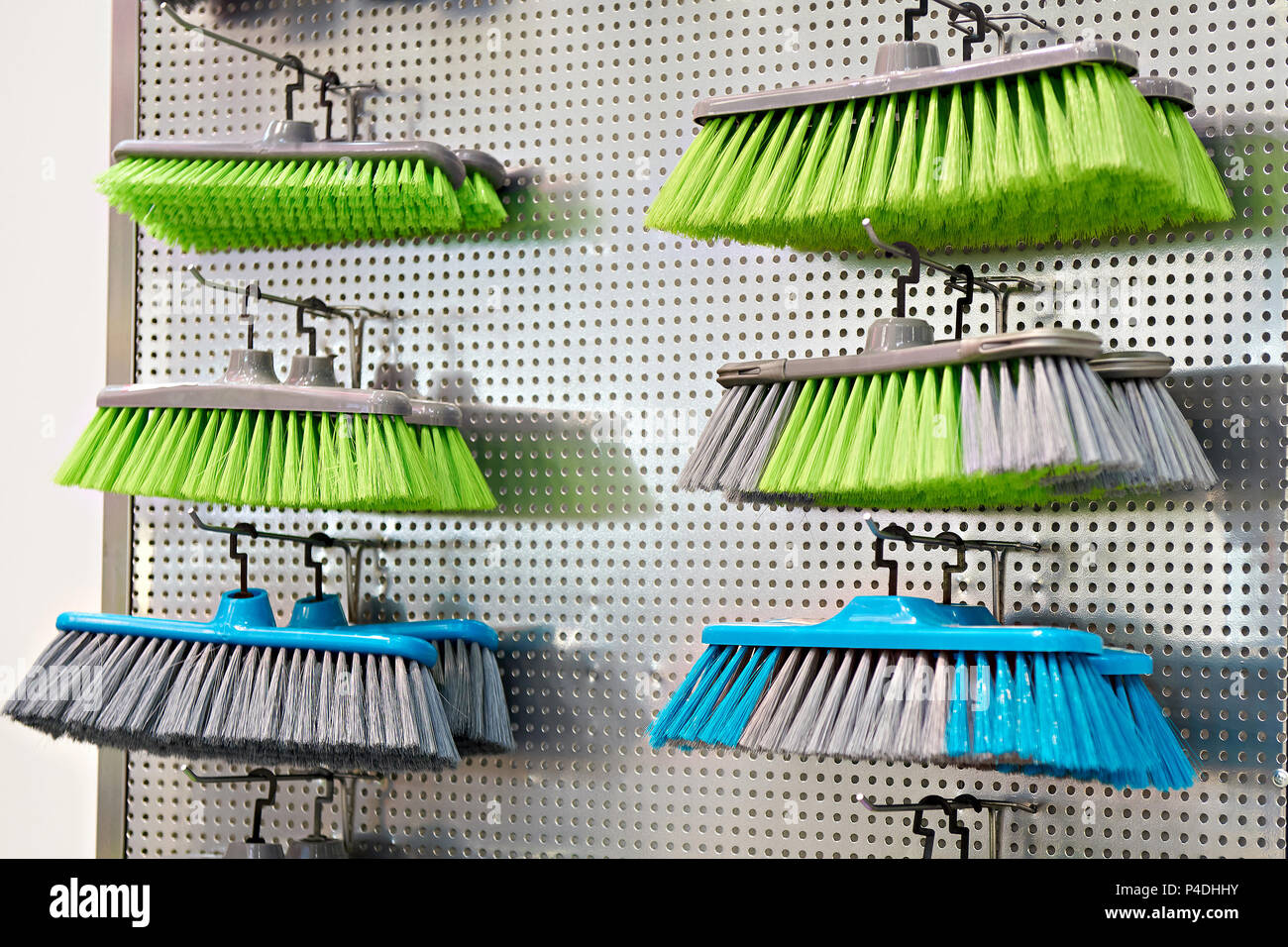 Plastic household brushes in the hardware store Stock Photo Alamy