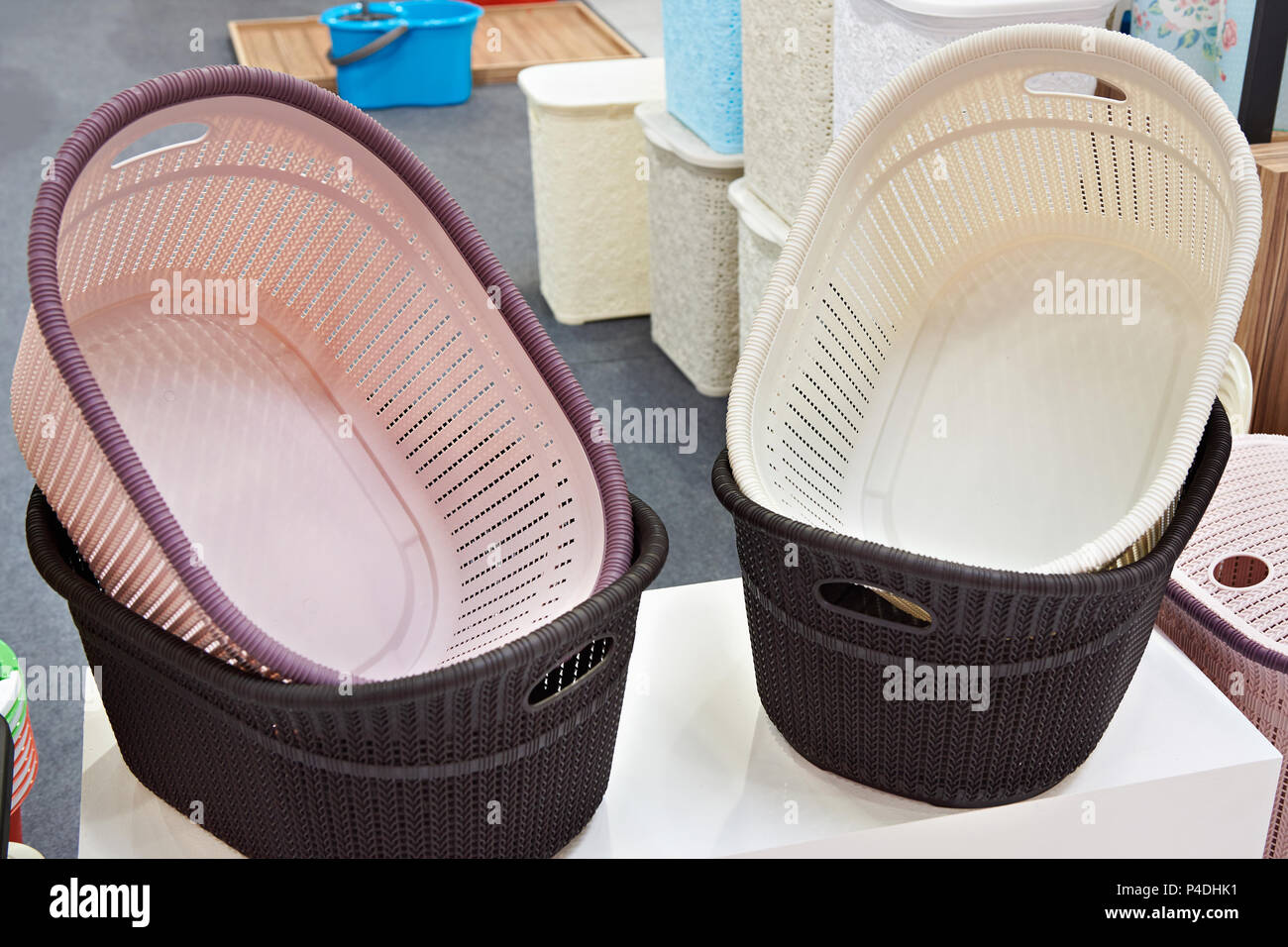 Plastic laundry baskets in the store Stock Photo Alamy