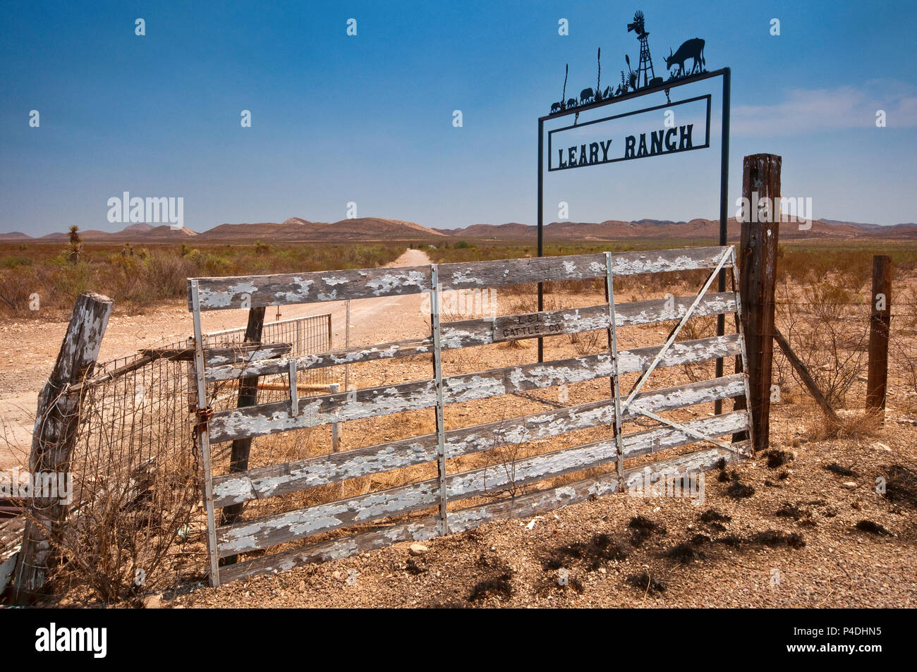 Wrought iron sign at road to ranch in Chihuahuan Desert near Marathon ...