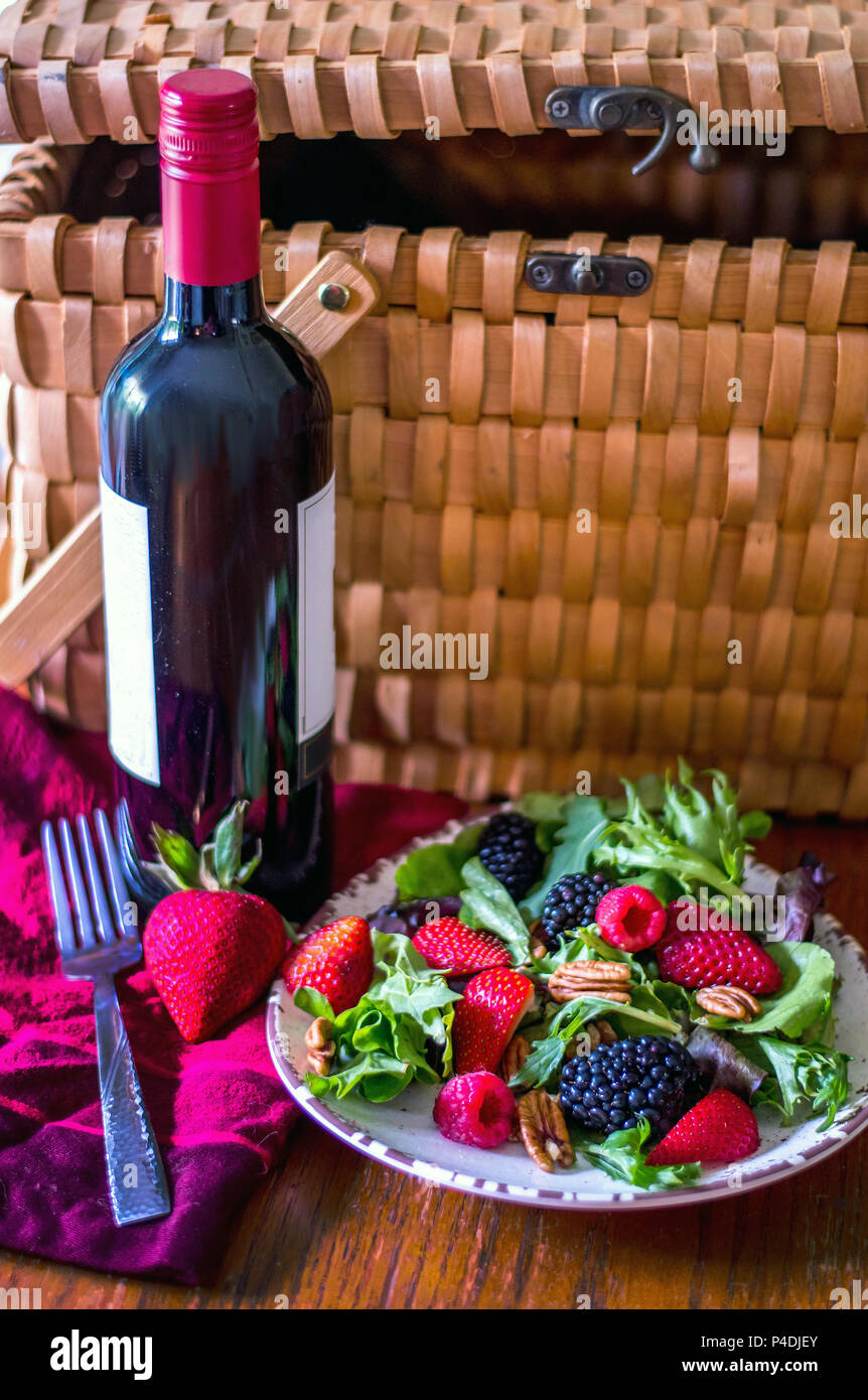 healthy picnic with red wine and a berry and nut salad Stock Photo
