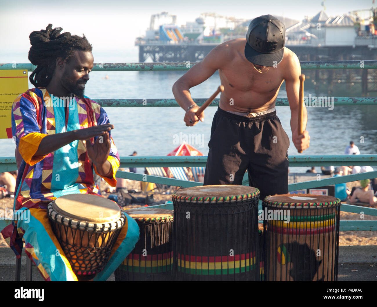 Playing the drums on Brighton seafront Stock Photo Alamy