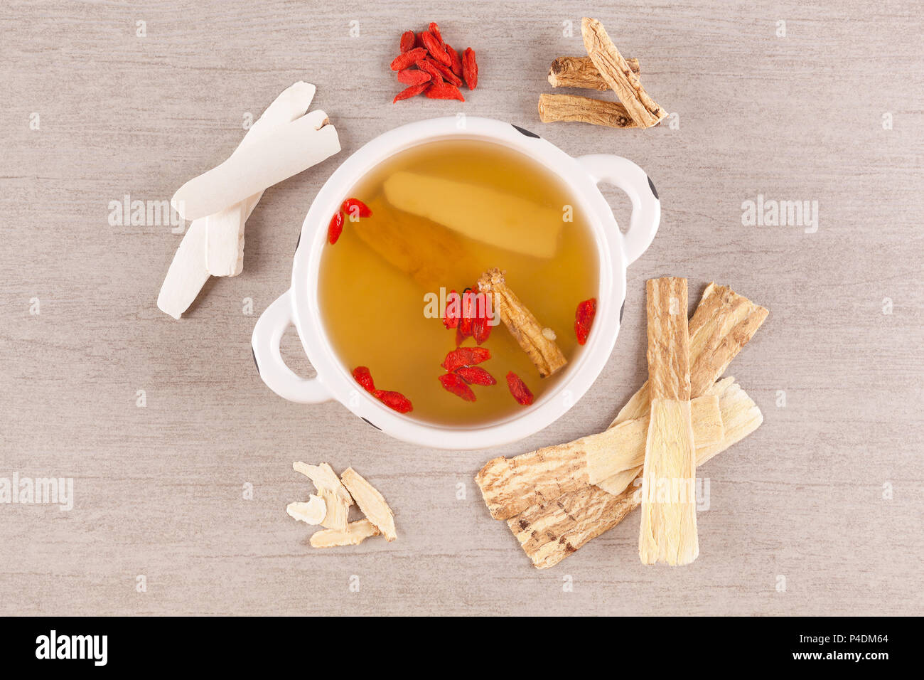 Different kind of Chinese herbal medicine for clear soup on gray background. Imunity booster. Stock Photo