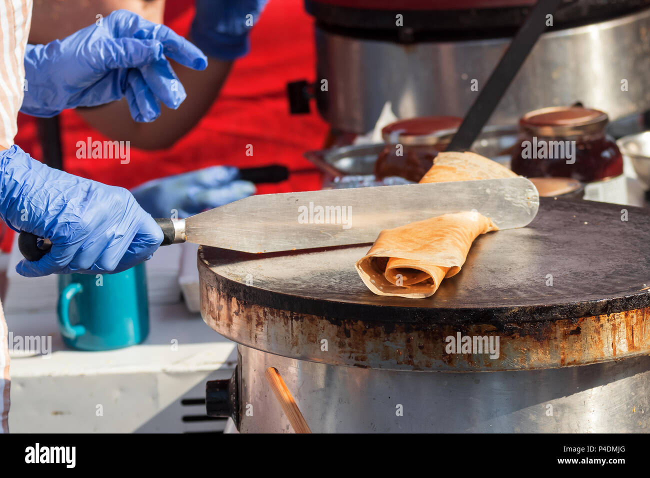 Farmers creperie, farmers street food market, vendor performs how to