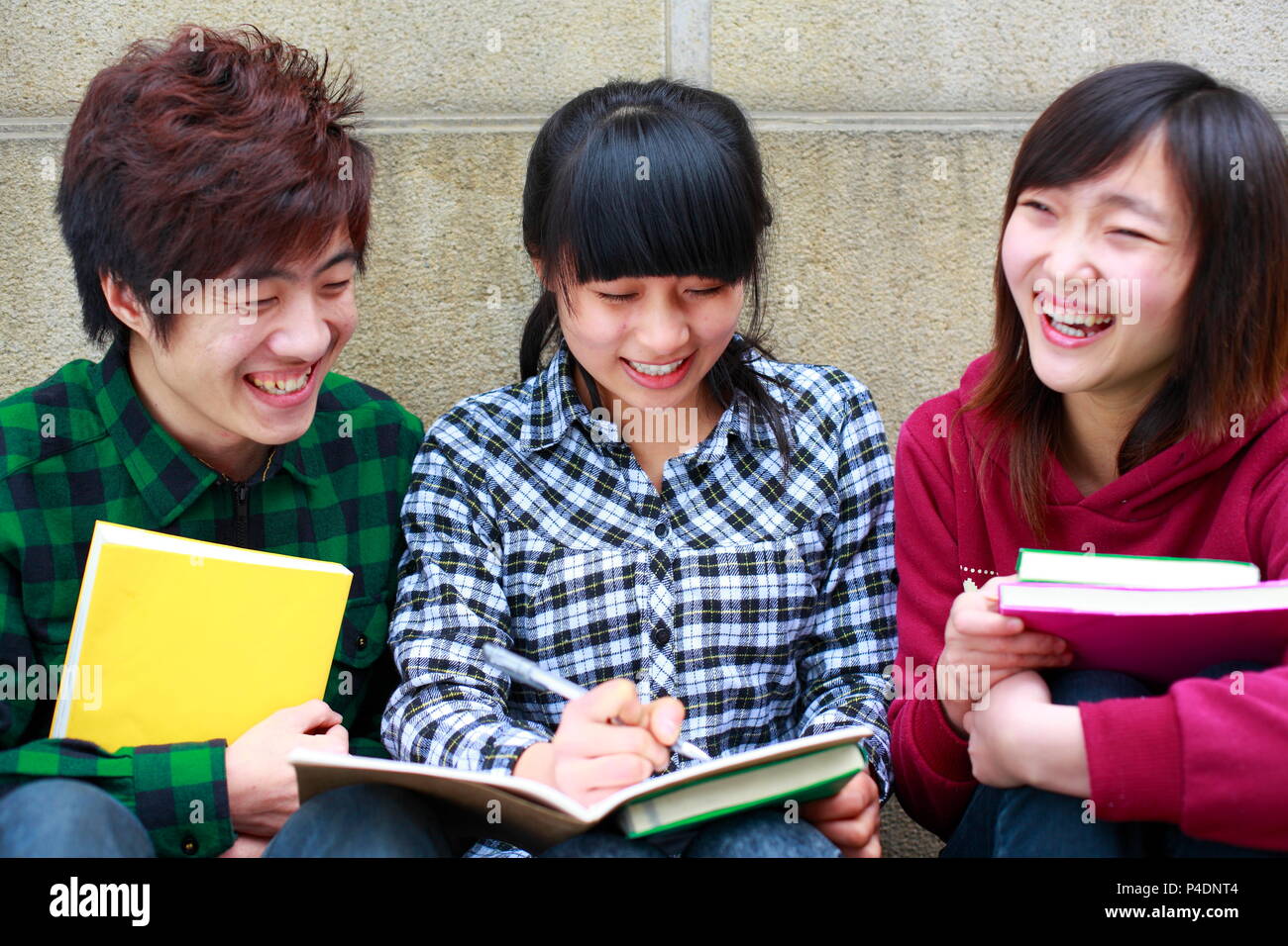 three asian college students study together in campus Stock Photo - Alamy