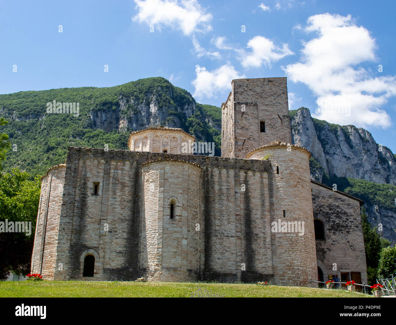 Medieval abbey of San Vittore al Chiuse, located in a large valley of the central Apennines (Italy) Stock Photo
