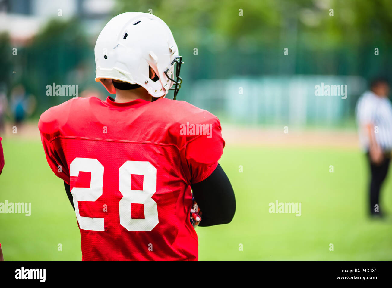 Saturated image of an American Football player in action Stock Photo