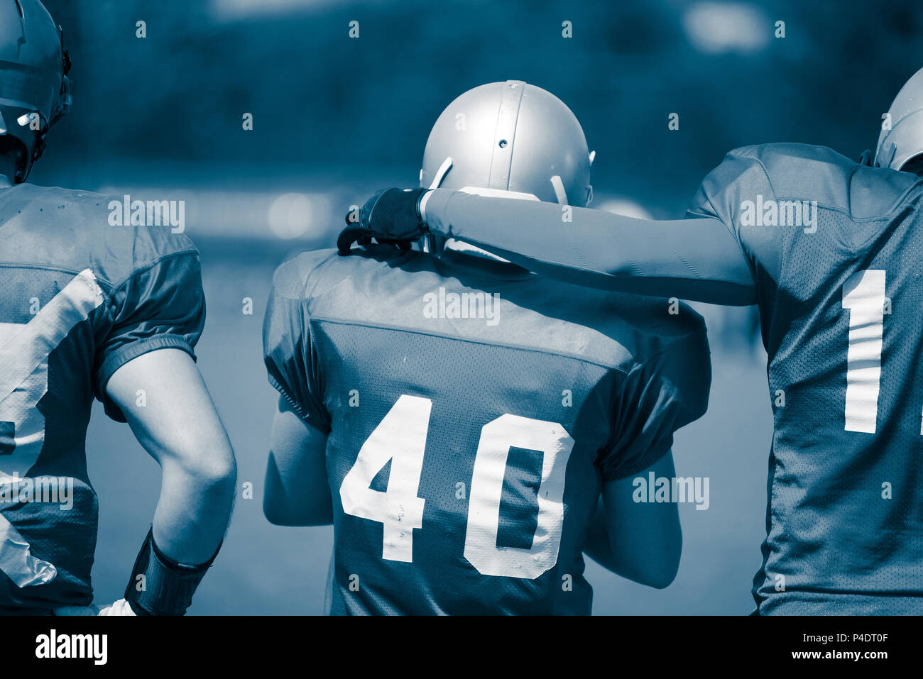 Cyanotype toned image of American Football players in action Stock Photo