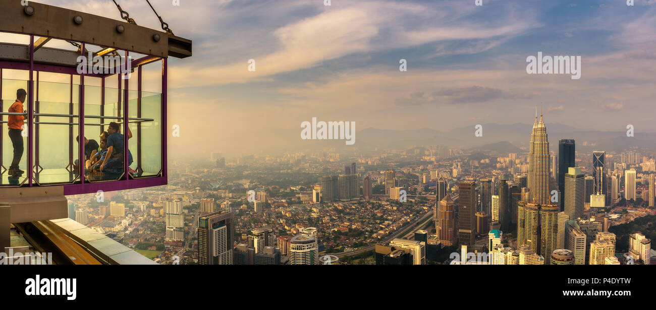 Visitors on top of the Menara KL Tower with panoramic view of Kuala Lumpur Stock Photo