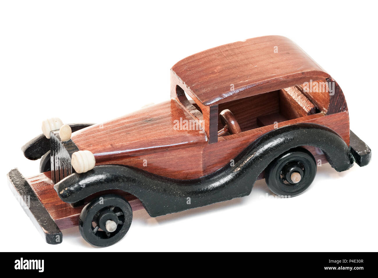Vintage wooden toy car isolated from background Stock Photo