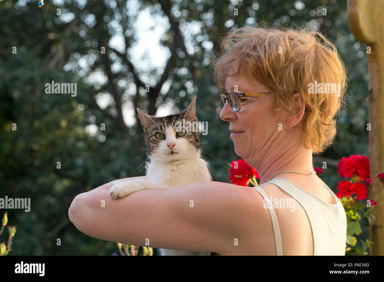 woman cuddling her cat Stock Photo