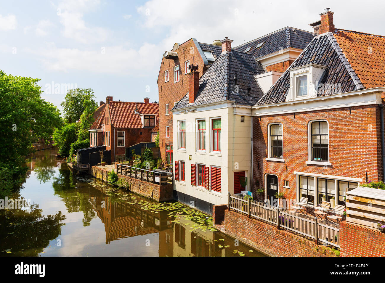 view of a canal with old buildings in Appingedam, Netherlands Stock Photo