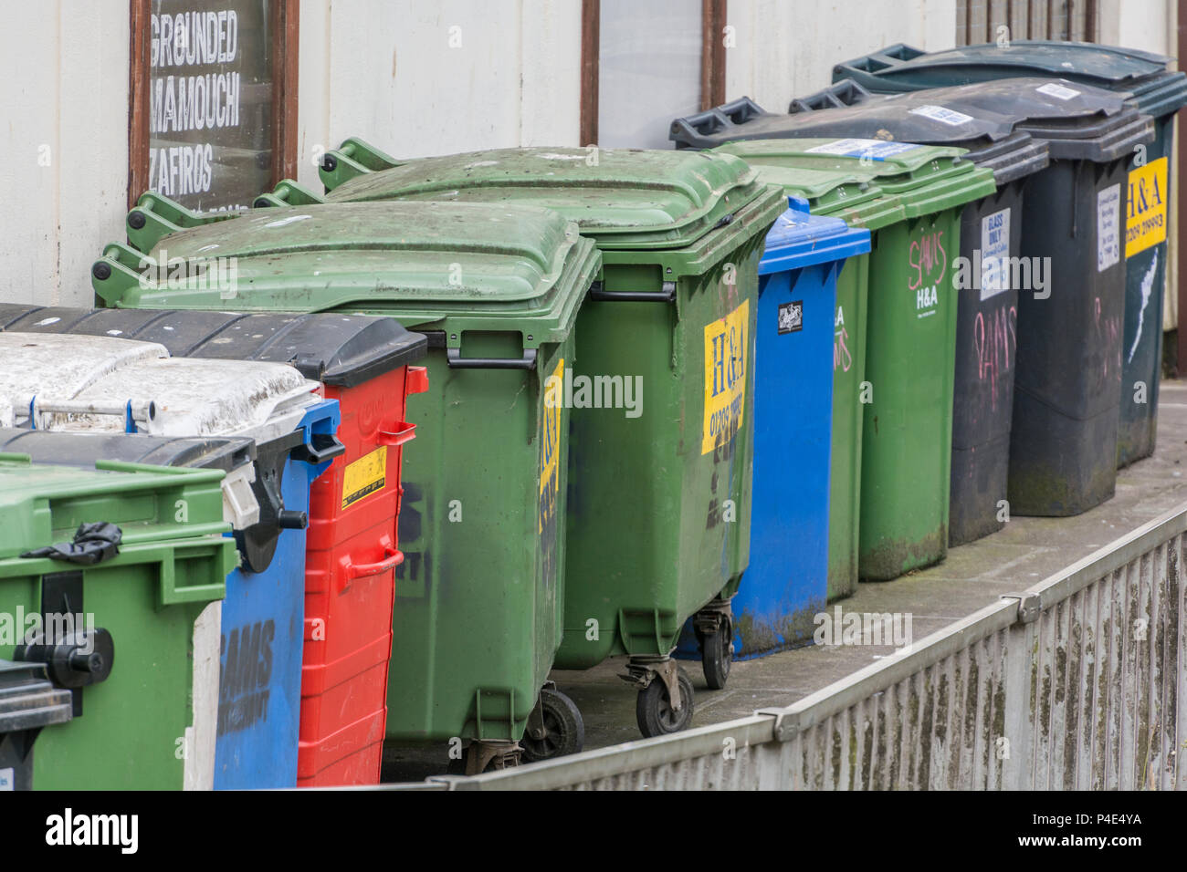 Collection of commercial wheelie bins / rubbish bins in Truro, Cornwall. Redundant data metaphor, commercial rubbish collection service. Stock Photo