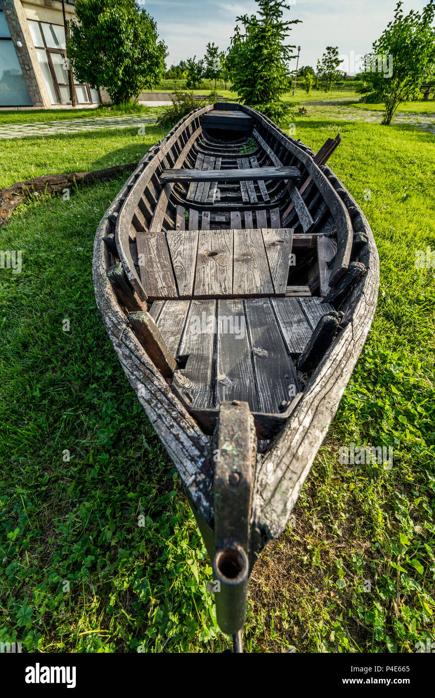 Old wooden boat abandoned on the shore Stock Photo - Alamy