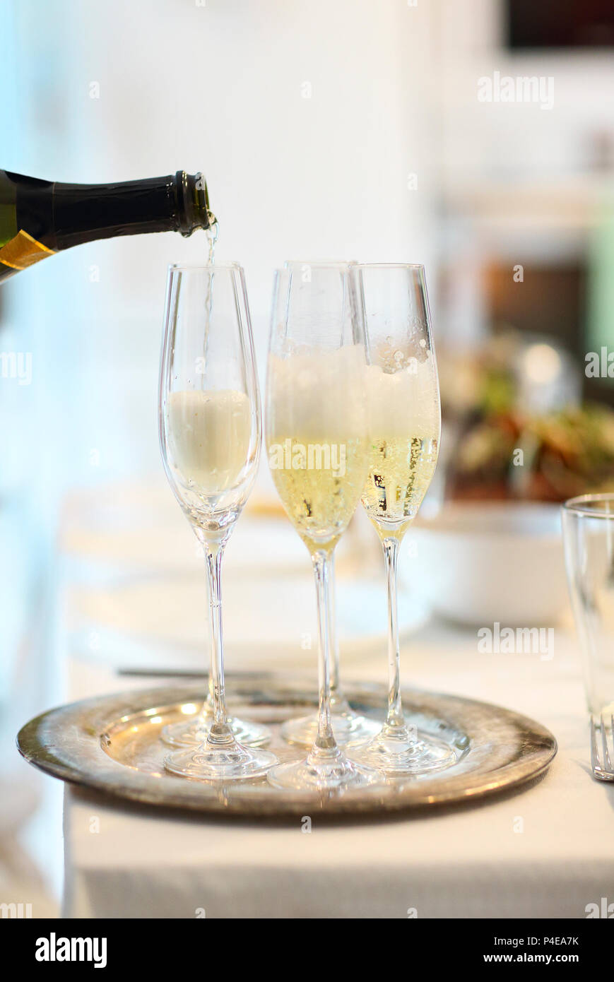 Champagne glasses and bottle in restaurant. Close up Stock Photo Alamy