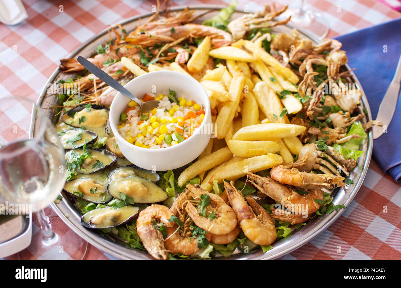 fried seafood crab, shrimps, mussels with French fries and rice Stock