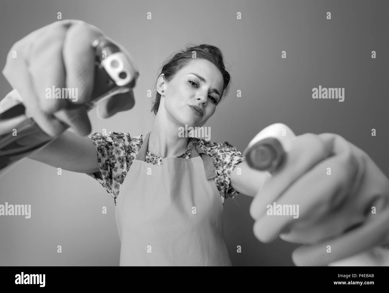 Big cleaning time. cool young housewife with rubber gloves using