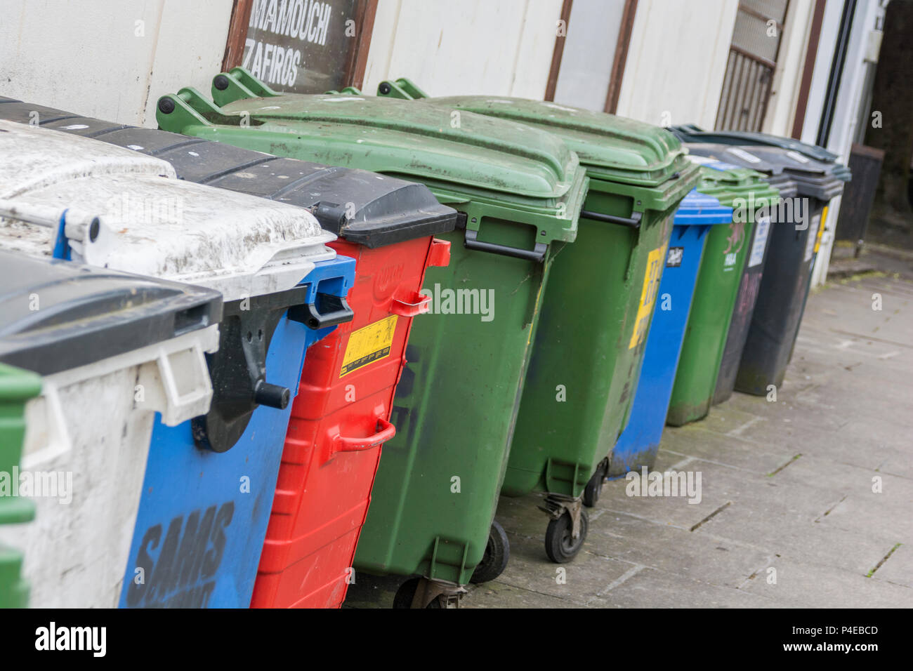 Collection of commercial wheelie bins / rubbish bins in Truro, Cornwall. Redundant data metaphor, commercial rubbish collection service. Stock Photo