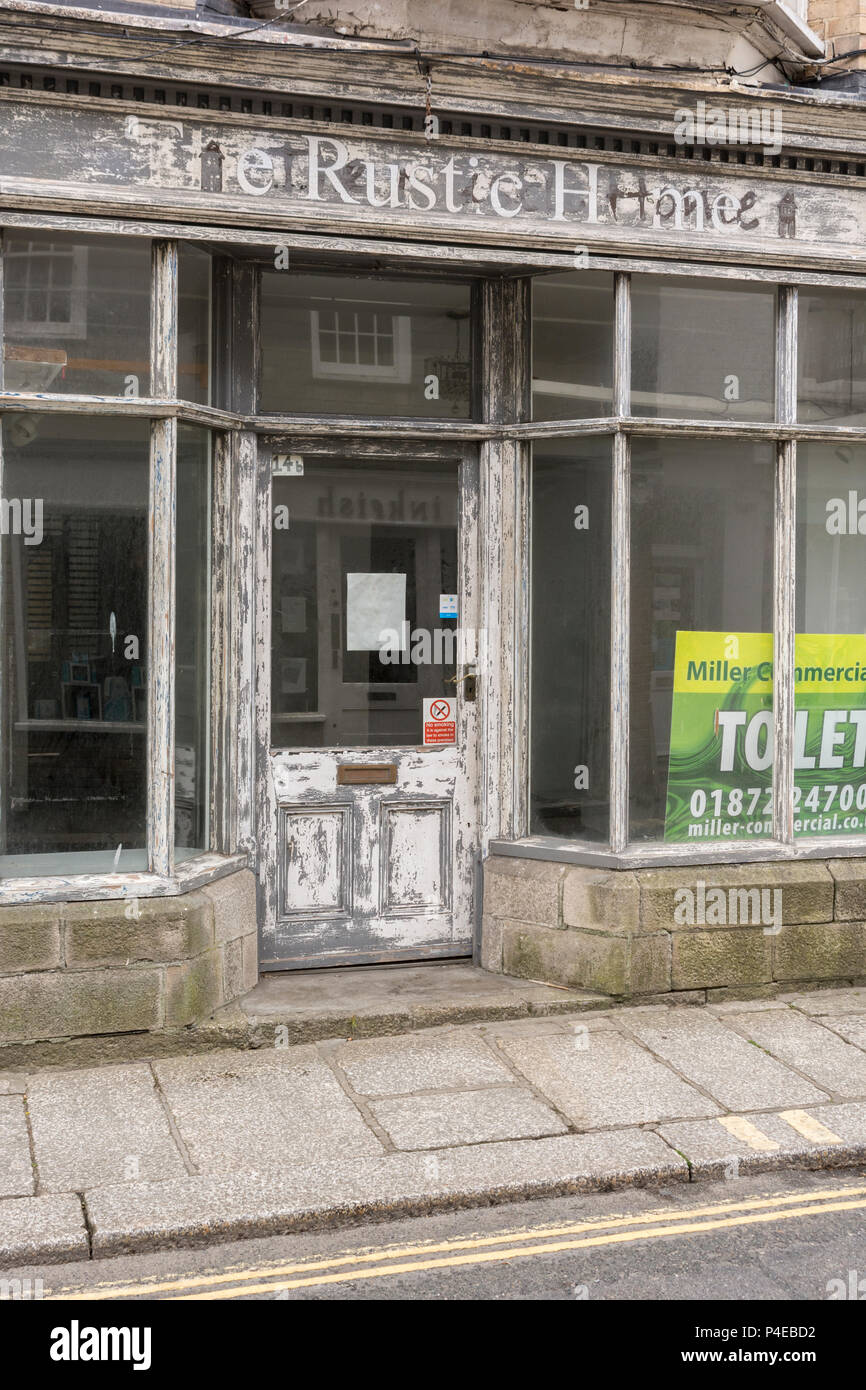 Closed vacant shop in Truro. Metaphor for high street decline, UK retail crisis, high street crisis, closed down shops, high street squeeze, recession Stock Photo