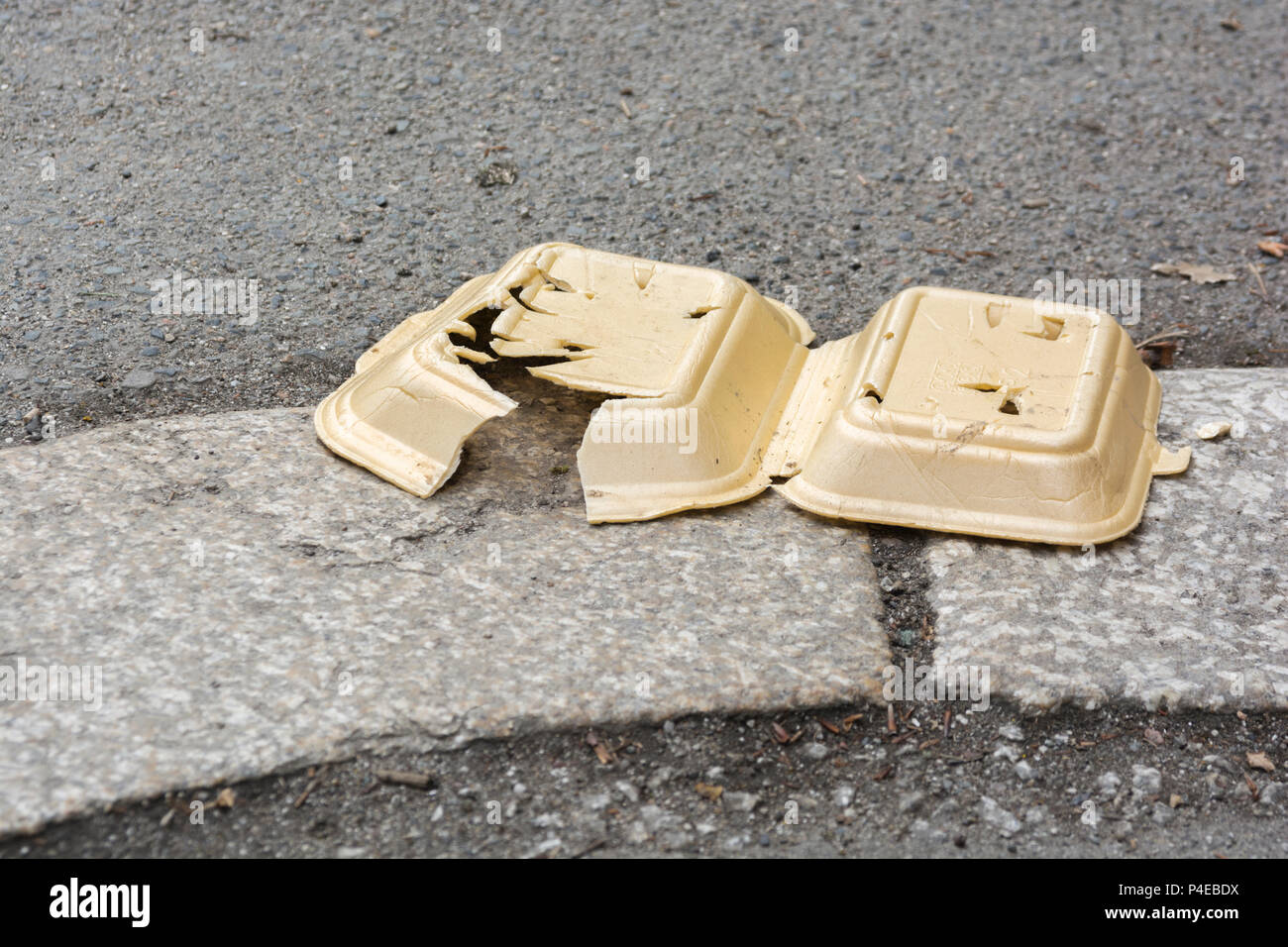 Discarded styrene takeaway food box litter, Truro kerbside. For single