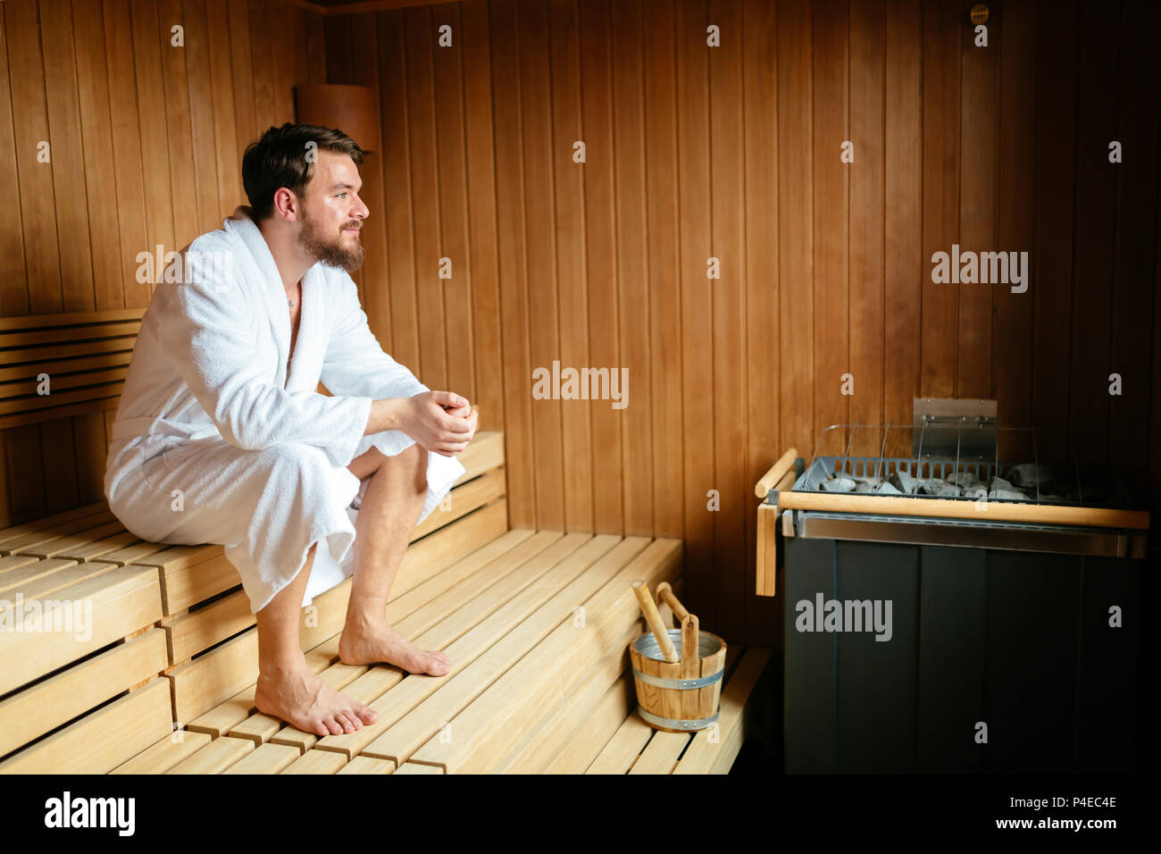 Handsome man relaxing in sauna Stock Photo