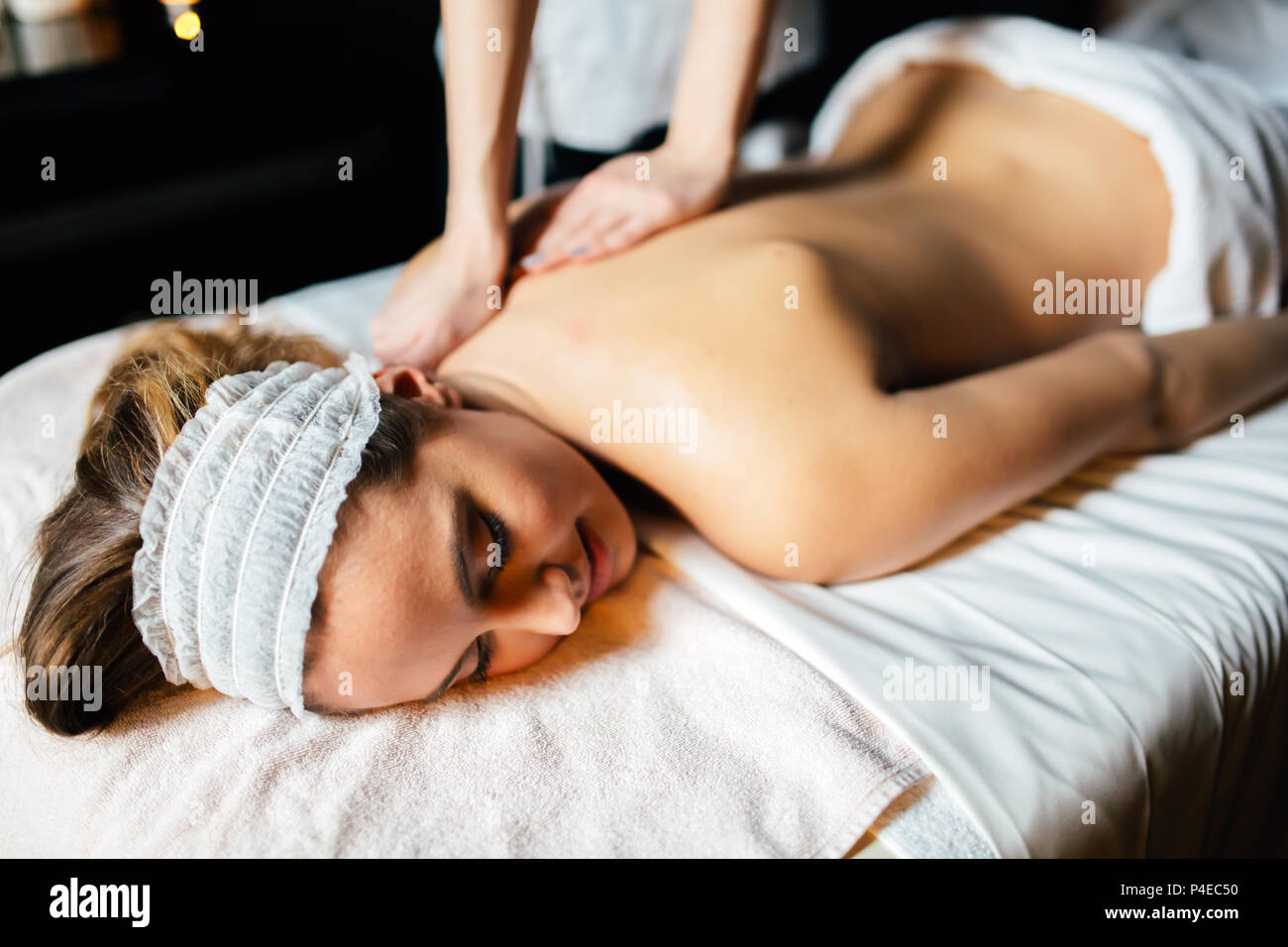 Beautiful woman enjoying massage treatment Stock Photo