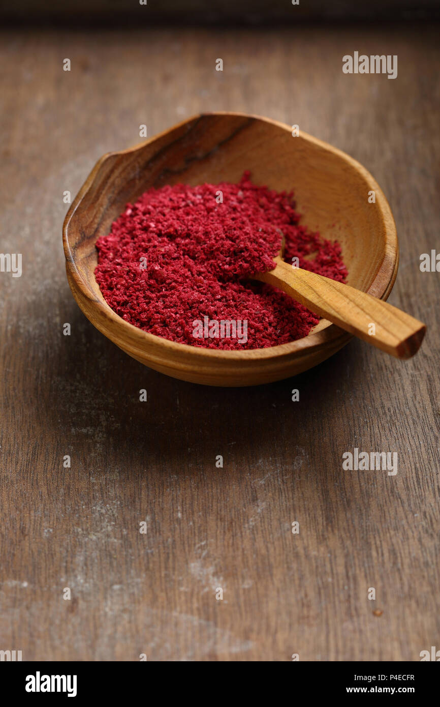 Flavor dry sumac in bowl, spice closeup Stock Photo Alamy