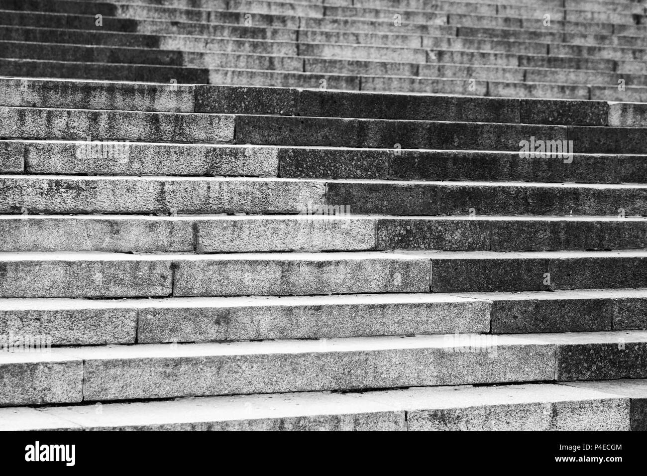 Abstract architecture fragment. Old stairway made of gray granite stone blocks, with decorative pattern Stock Photo