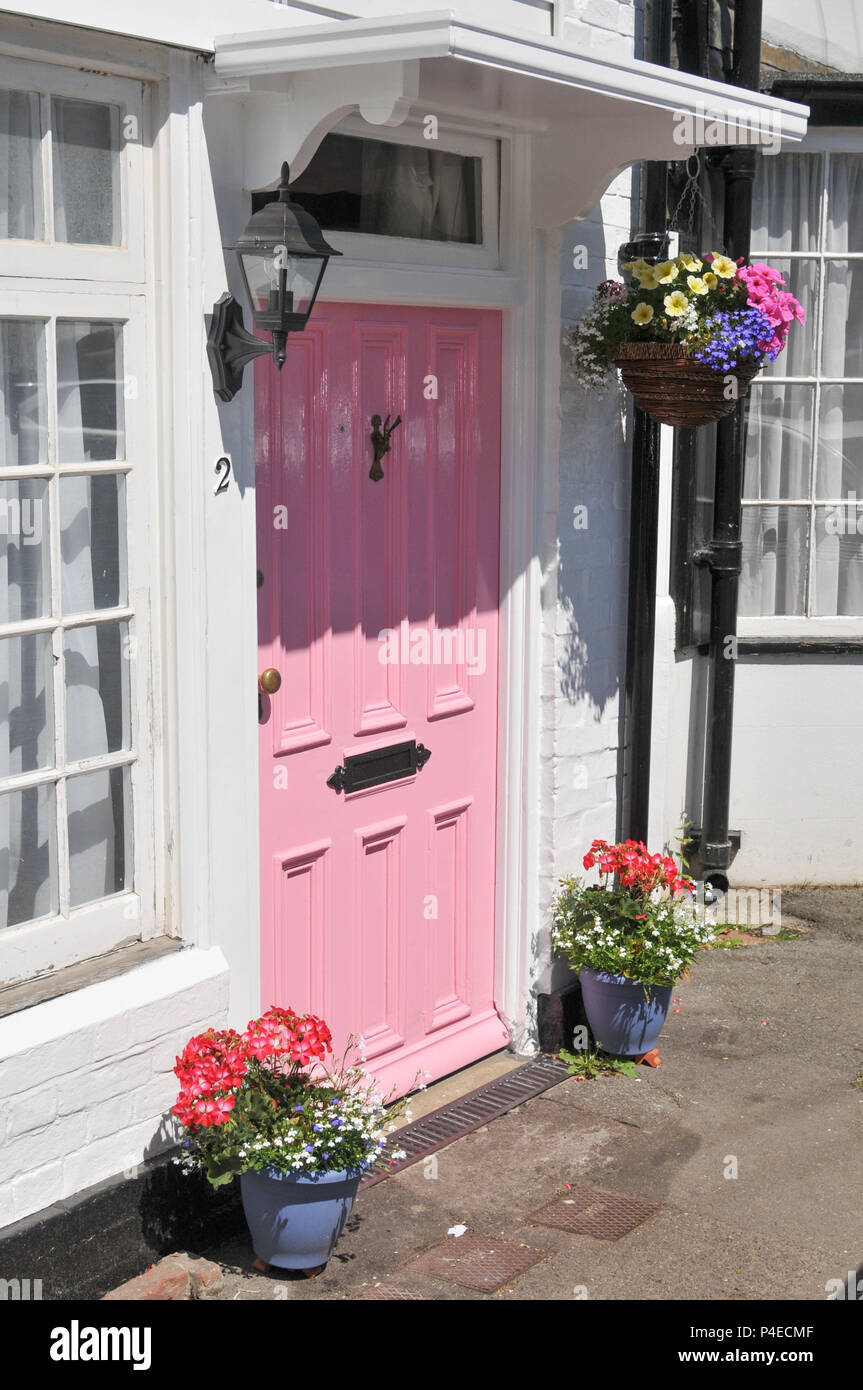 Pink front door on a white house on Harfield Highstreet in Kent