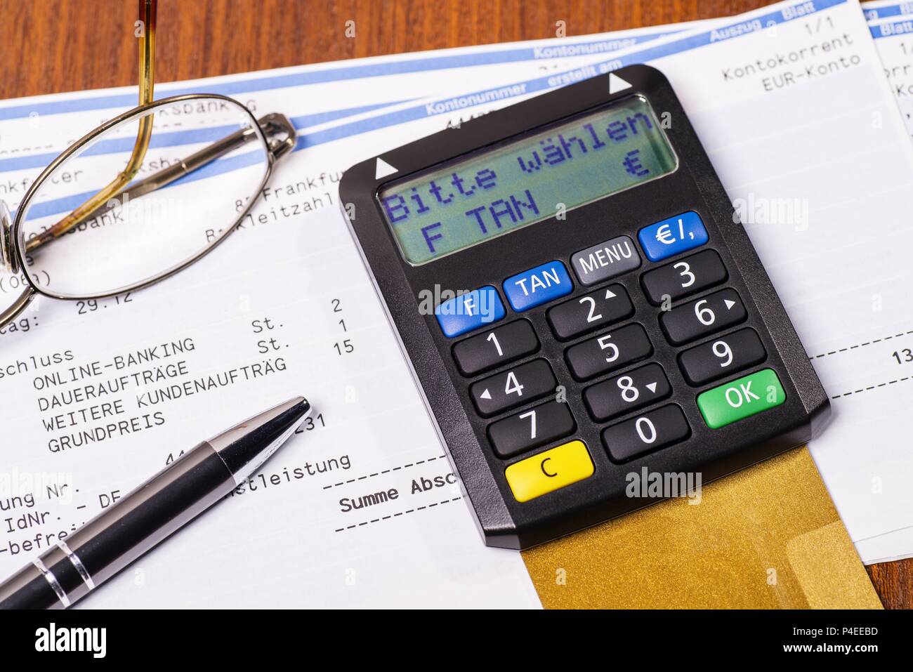 Tan generator with check card and statement of bank account | usage  worldwide Stock Photo - Alamy